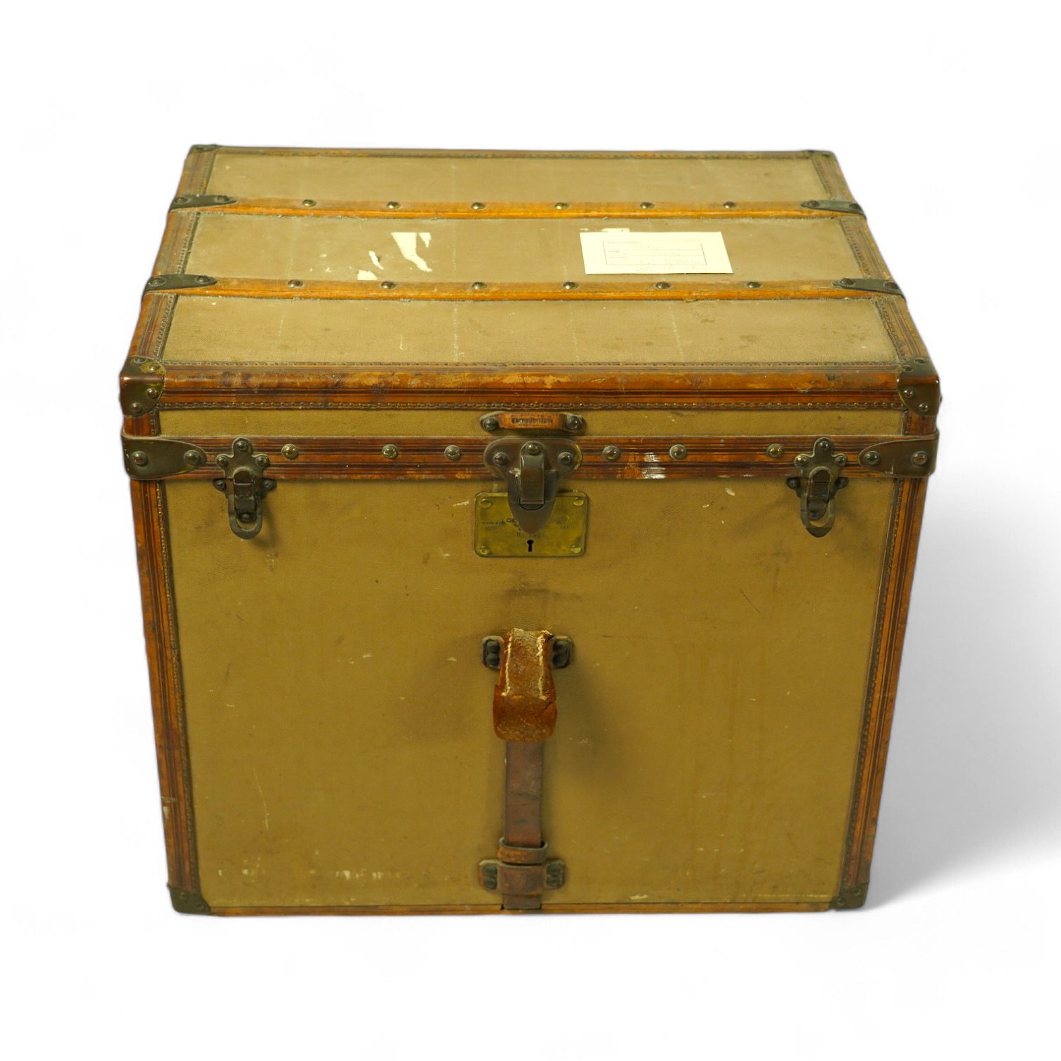 A vintage Louis Vuitton trunk, with brass and leather mounts and studded wooden slats, in plain beige canvas, with label for Paris and London, number 159008, 61cm wide, 48cm deep, 53cm high